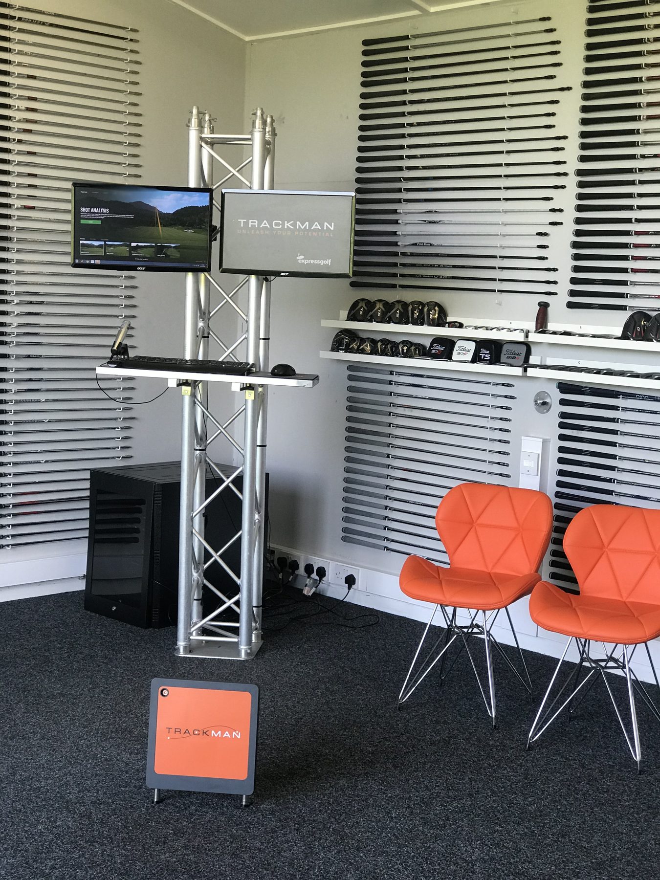 TrackMan launch monitor and screens in the Express Golf custom fitting bay